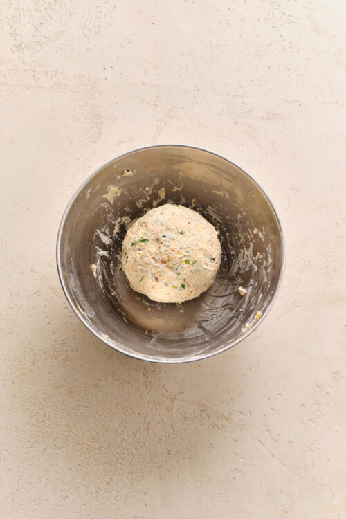 Forming the Cheese Ball Recipe mixture into a round ball.