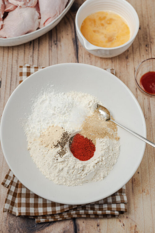 Combining all-purpose flour, cornstarch, and spices for Fried Chicken Recipe